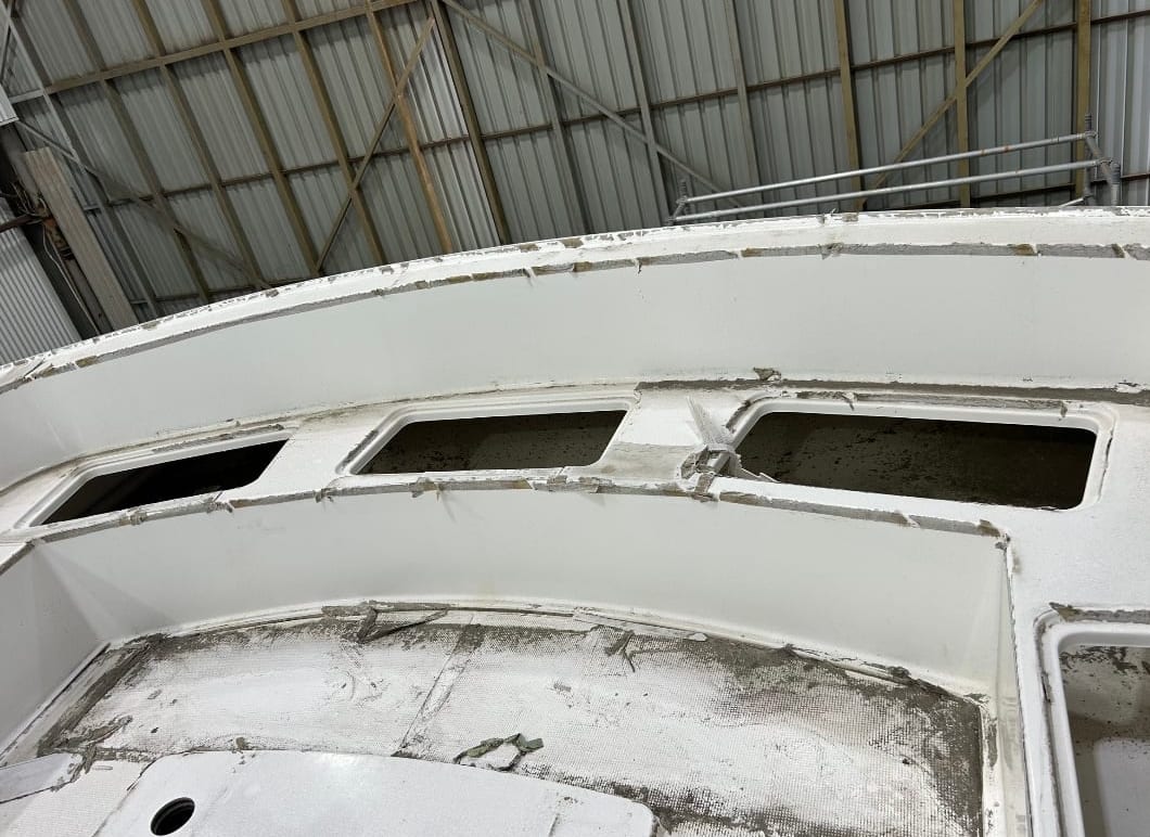 Foredeck, coamings and vent surrounds before correction — chalked, heavily stained gelcoat and grimy seams